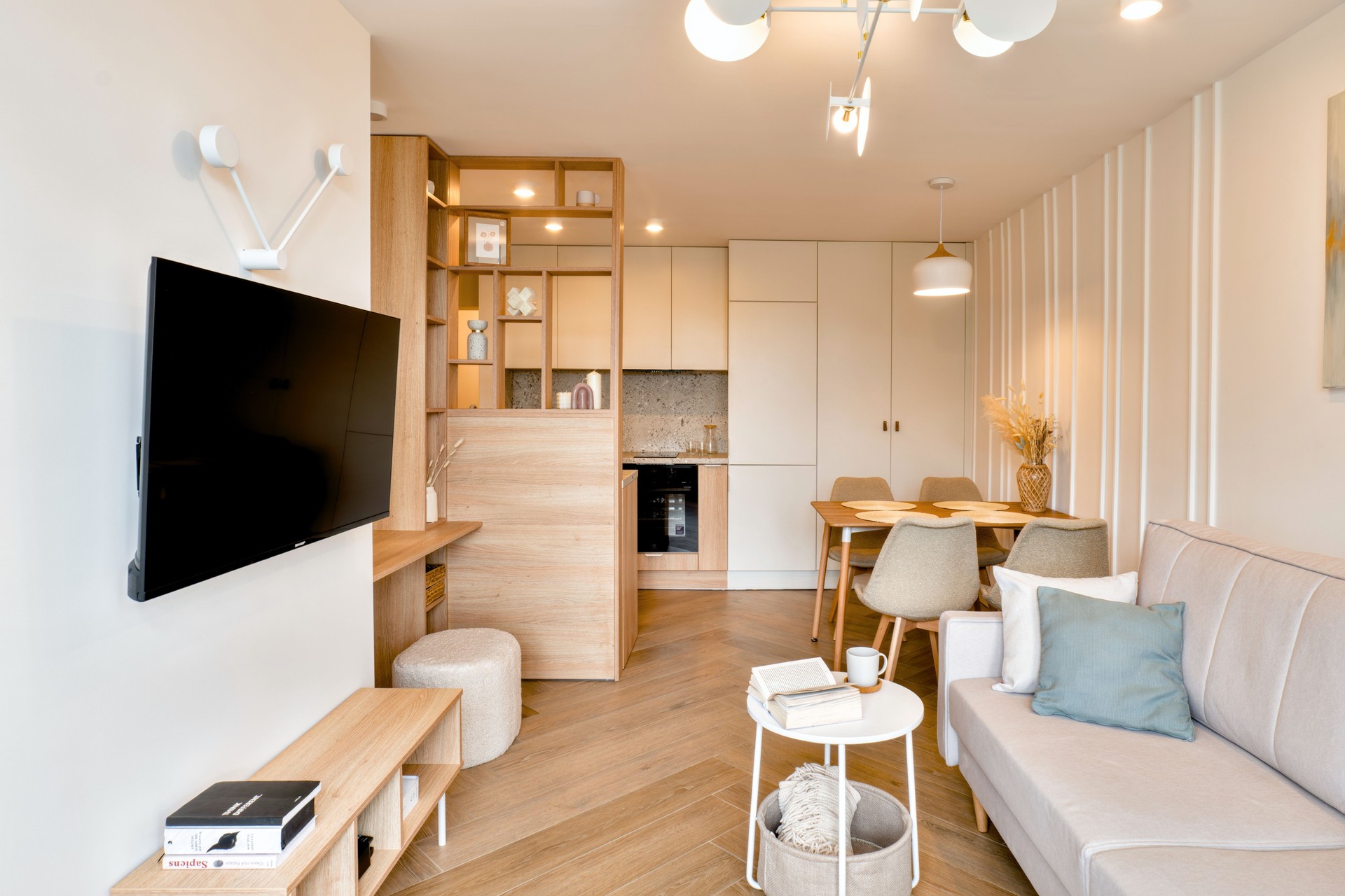 A Stylish Modern Living Room Featuring an Open Kitchen Design that Combines Comfort and Convenience